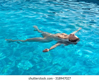 Young nudist at pool