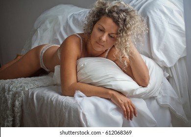 Hot mature woman in bed