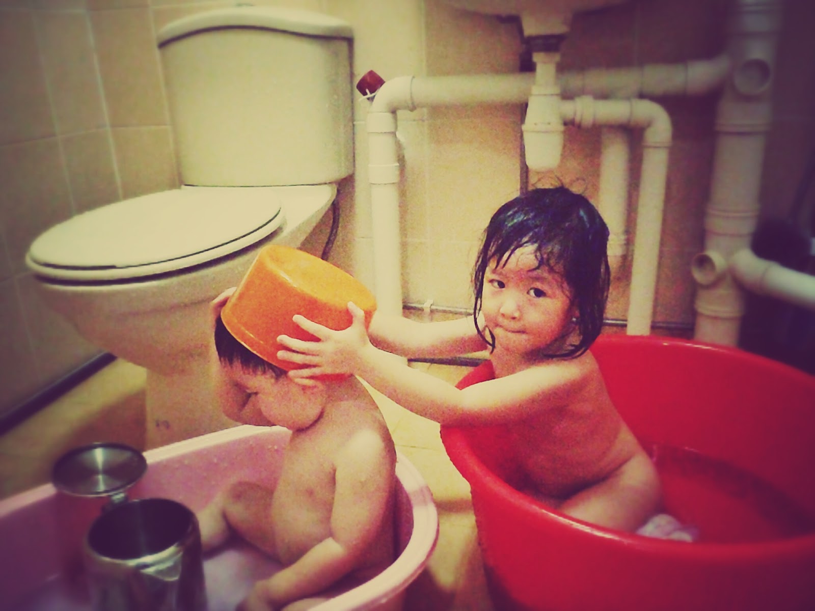 Girls and boys taking baths