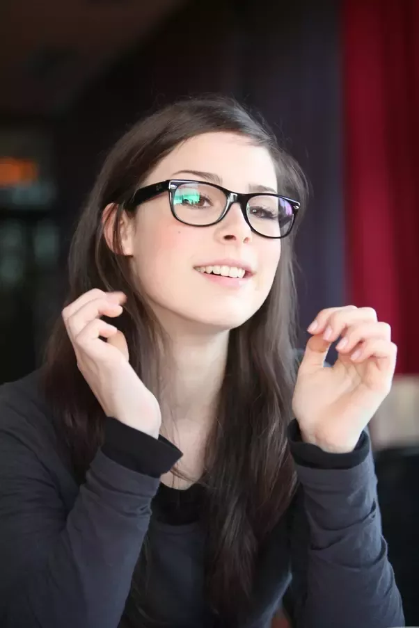 Tiny teen girl wearing glasses